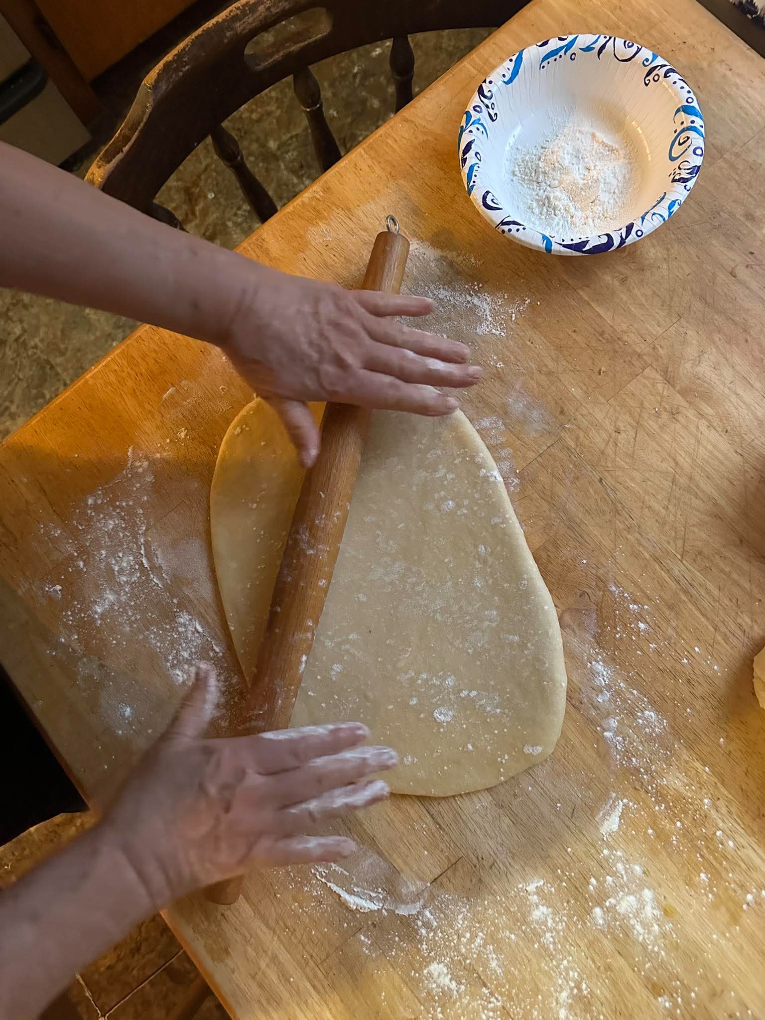 Briere's mother rolling dough